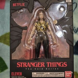 Bandai Stranger Things Eleven Action Figure - Yellow and Black
